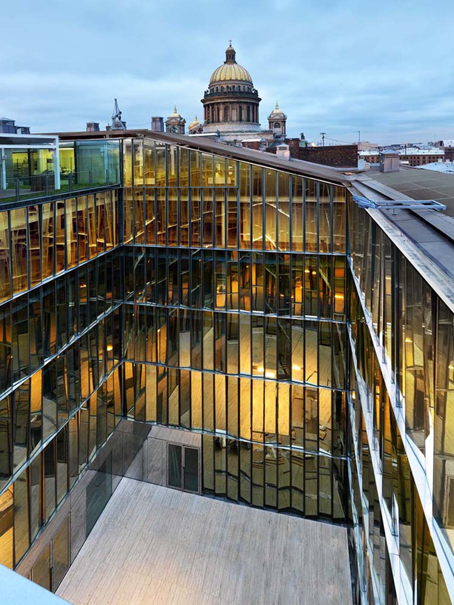 image of a glass facade reflecting different colors